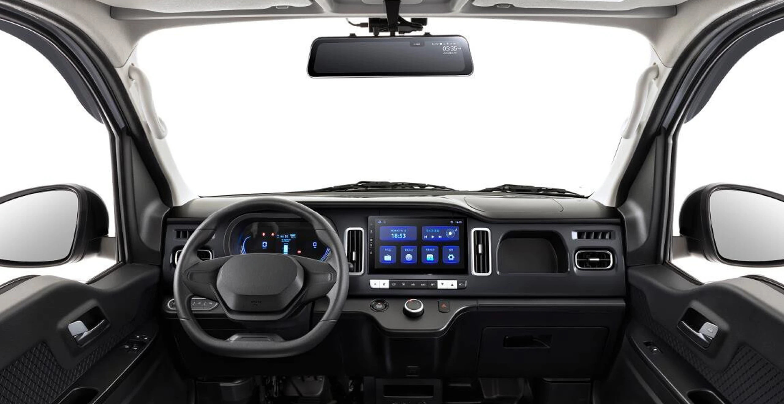 Interior view of the Indigo Dash electric vehicle, featuring a digital dashboard, steering wheel, and touch-screen control panel.